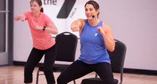 Virtual bootcamp lead by white female in blue top
